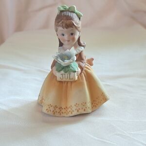Lefton July Birthday  Figurine with Yellow Dress and Green Bow. Vintage